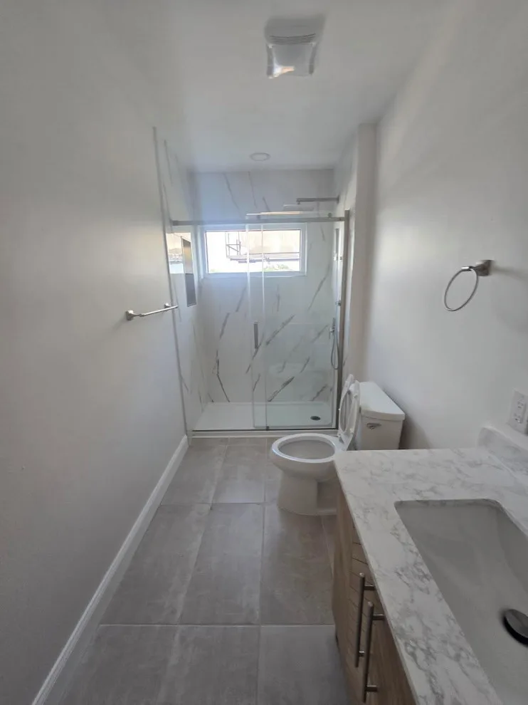 Marble White Bathroom Renovation by Level Up Construction & Investment Group LLC - Photo 5
