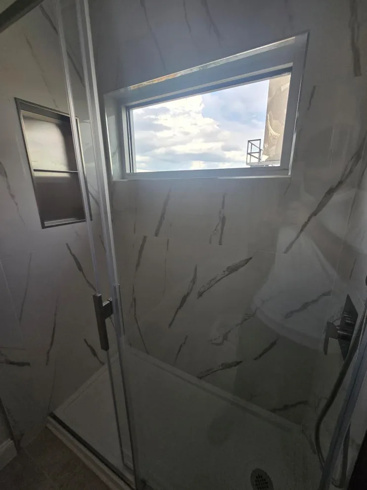 Marble White Bathroom Renovation by Level Up Construction & Investment Group LLC - Photo 3