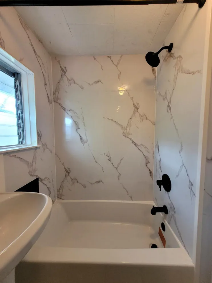 Marble White Bathroom Renovation by Level Up Construction & Investment Group LLC - Photo 6