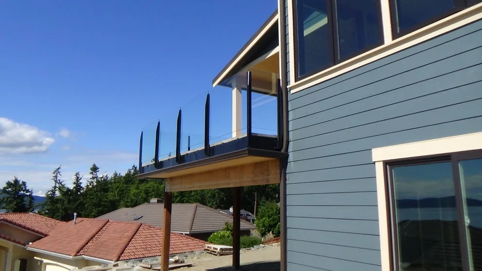 Glass-railed paver deck by Dexperts - Photo 6
