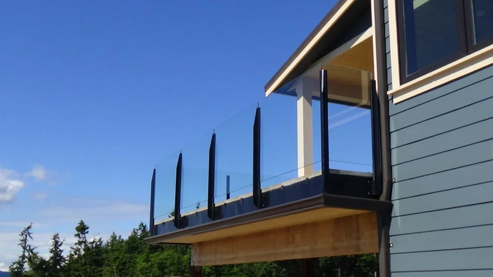 Glass-railed paver deck by Dexperts - Photo 5