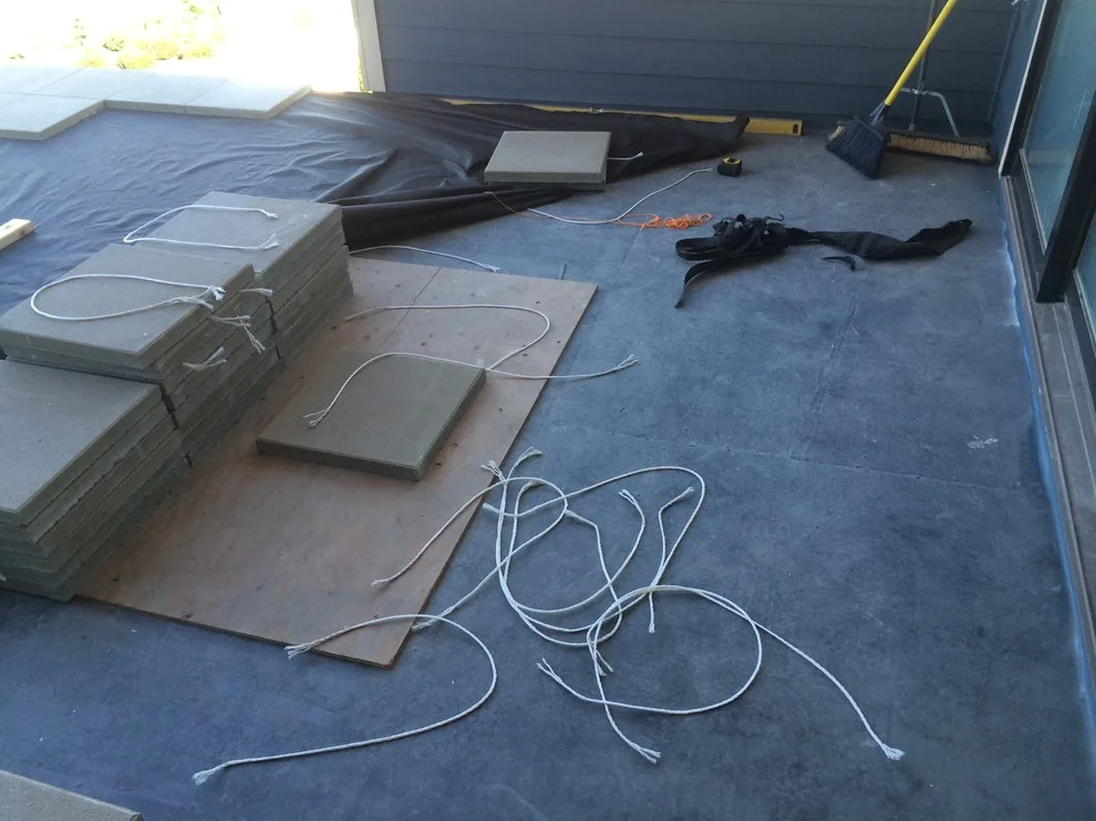 Glass-railed paver deck by Dexperts - Photo 2