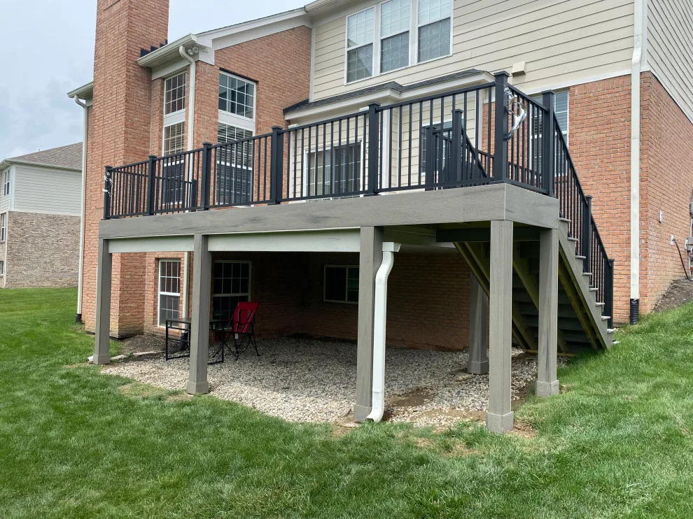 Tiered composite deck with metal railing by DeckThisOut - Photo 4