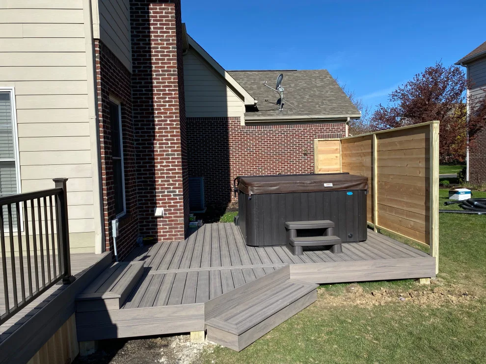 Tiered composite deck with metal railing by DeckThisOut - Photo 7