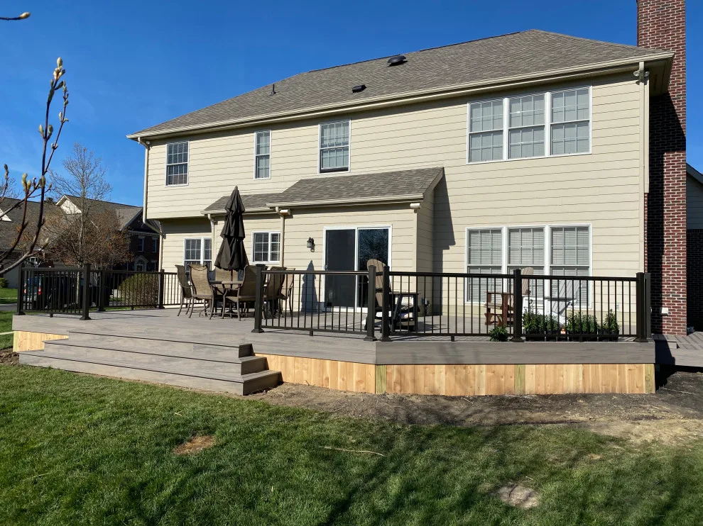 Tiered composite deck with metal railing by DeckThisOut - Photo 2