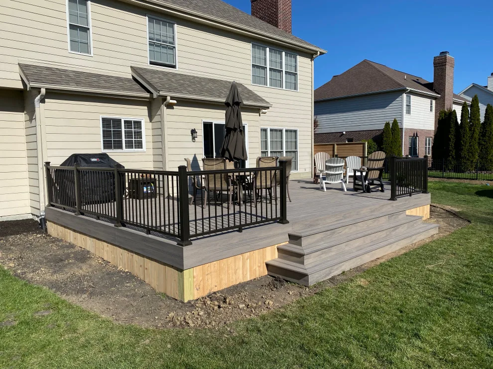 Tiered composite deck with metal railing by DeckThisOut - Photo 9