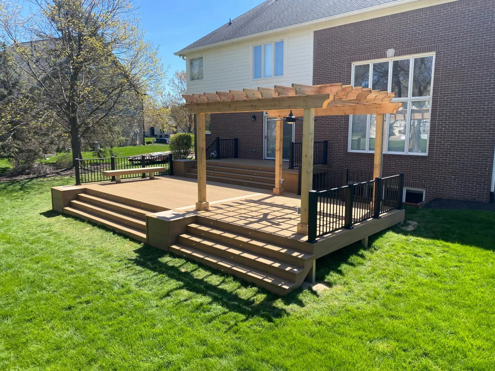 Tiered composite deck with metal railing by DeckThisOut - Photo 8