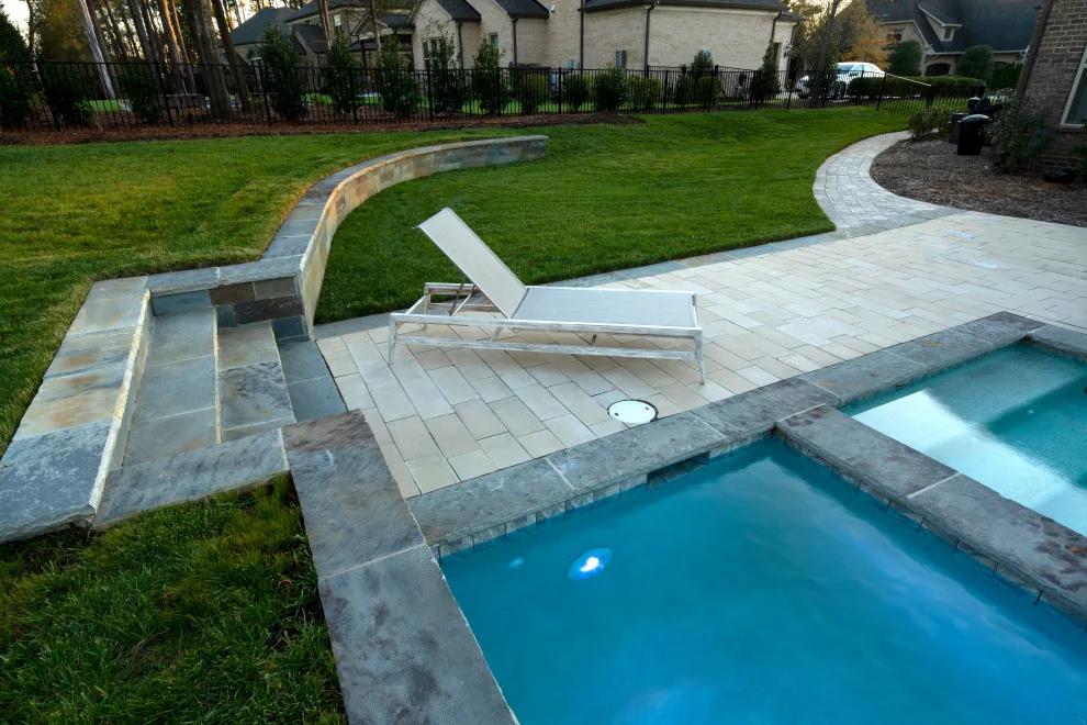 Outdoor Oasis with Swimming Pool and Culinary Area by The Stone Man - Photo 9