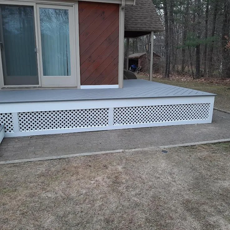 Ground-Level Wraparound Deck with Angled Composite Decking by Dynamic Deck Solutions - Photo 3