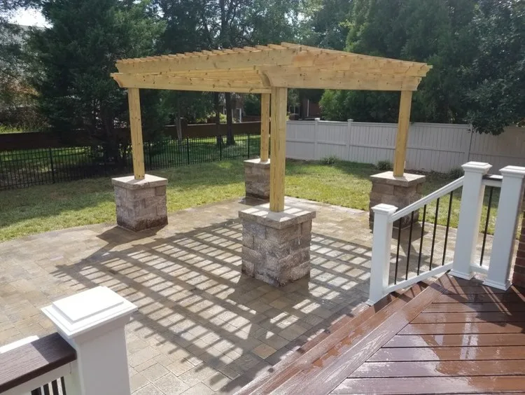 Trex Decking, Pergola, and Urbana Tumbled Pavers by Deckscapes Inc - Photo 2