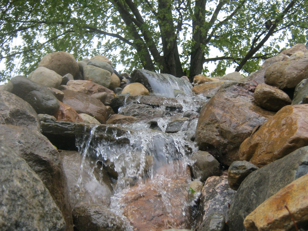 Greenwalt Waterfall, native field stone, natural elements and custom landscape by Premiere Aquascapes - Photo 5