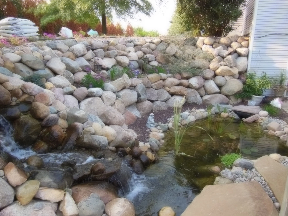 Greenwalt Waterfall, native field stone, natural elements and custom landscape by Premiere Aquascapes - Photo 4
