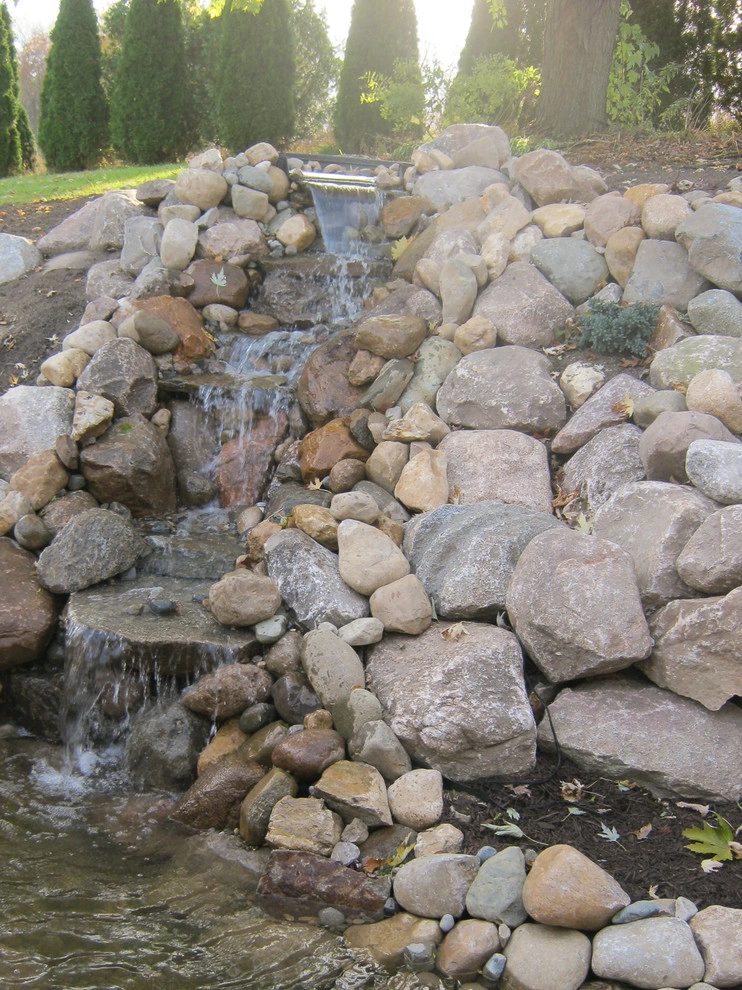 Greenwalt Waterfall, native field stone, natural elements and custom landscape by Premiere Aquascapes - Photo 9