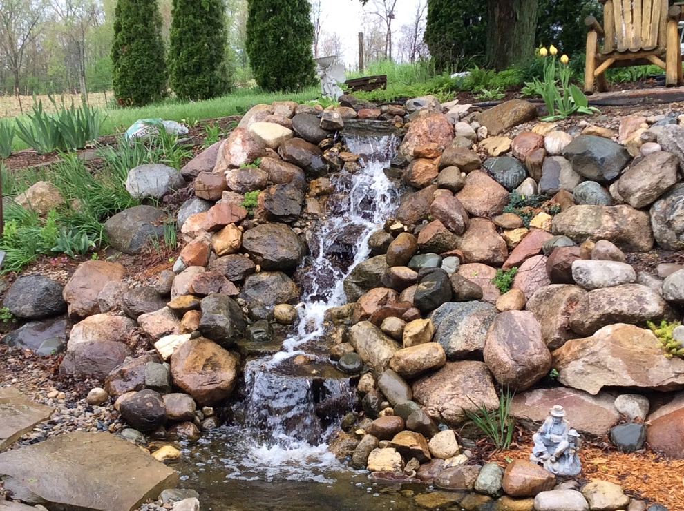 Greenwalt Waterfall, native field stone, natural elements and custom landscape by Premiere Aquascapes - Photo 8