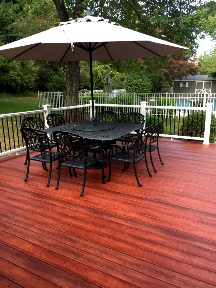 Zuri Brazila Deck Featuring White Trex Railing by Miles Deck Construction - Photo 2