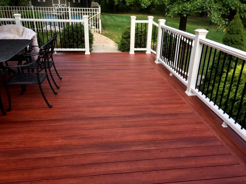 Zuri Brazila Deck Featuring White Trex Railing by Miles Deck Construction - Photo 7