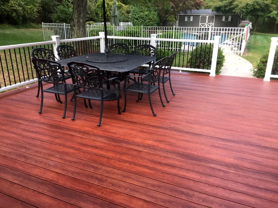 Zuri Brazila Deck Featuring White Trex Railing by Miles Deck Construction - Photo 3