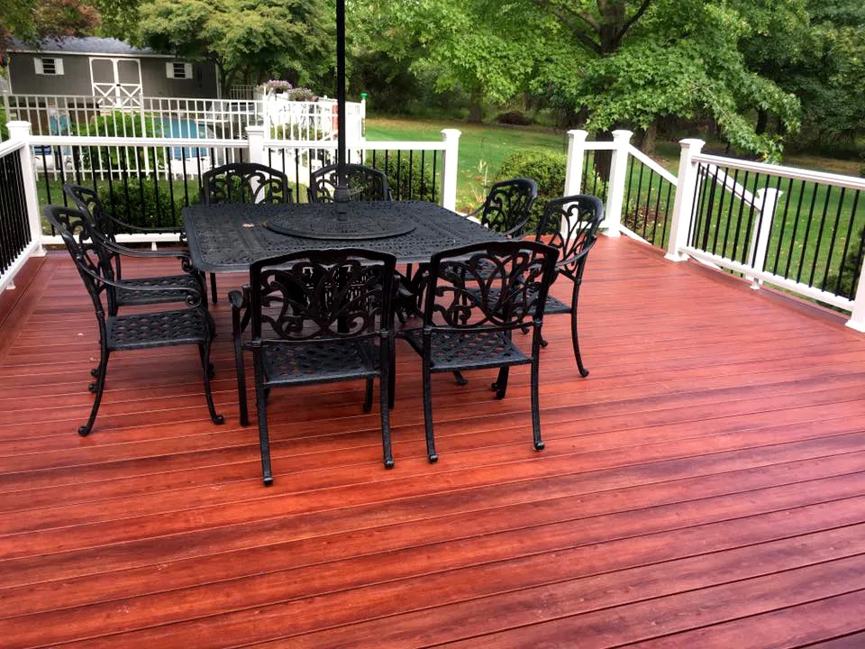 Zuri Brazila Deck Featuring White Trex Railing by Miles Deck Construction - Photo 9