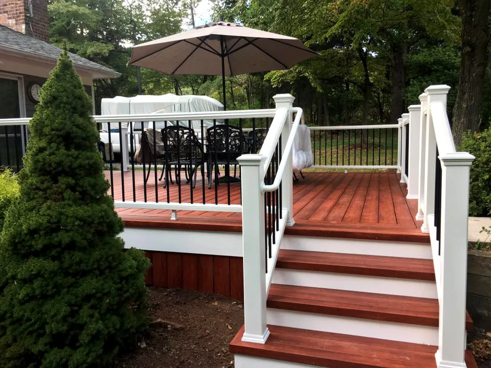 Zuri Brazila Deck Featuring White Trex Railing by Miles Deck Construction - Photo 4