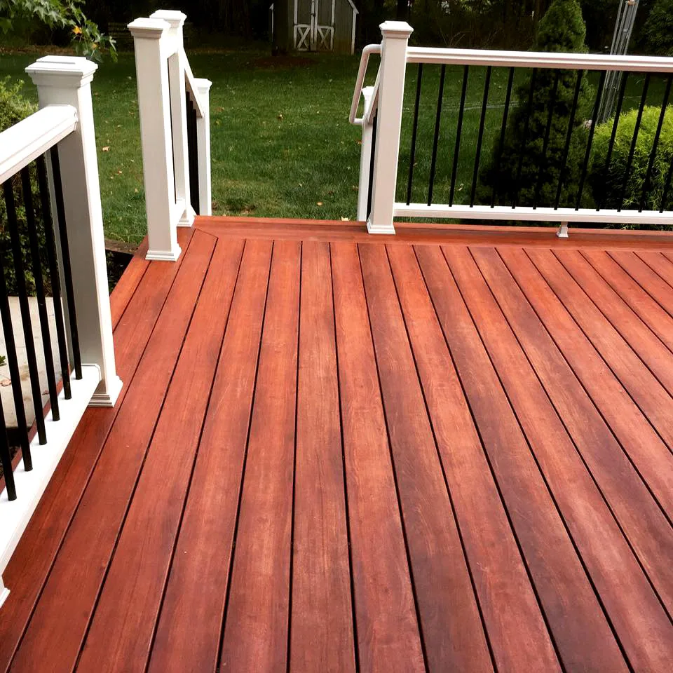 Zuri Brazila Deck Featuring White Trex Railing by Miles Deck Construction - Photo 5