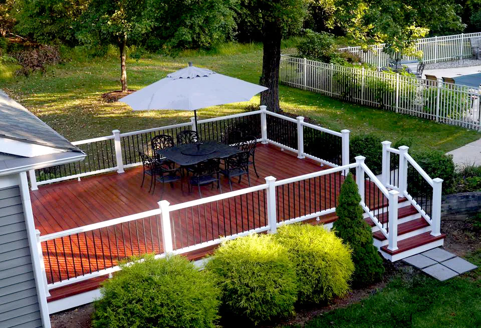 Zuri Brazila Deck Featuring White Trex Railing by Miles Deck Construction - Photo 10