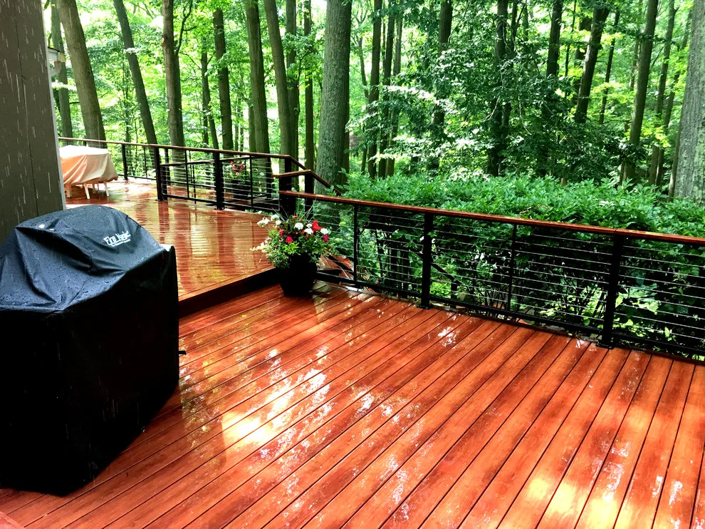Zuri patio featuring Feeney cable railing by Miles Deck Construction - Photo 5
