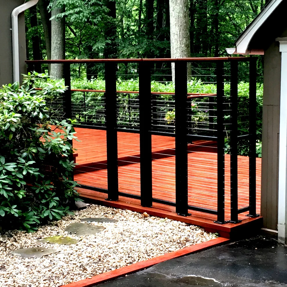 Zuri patio featuring Feeney cable railing by Miles Deck Construction - Photo 6