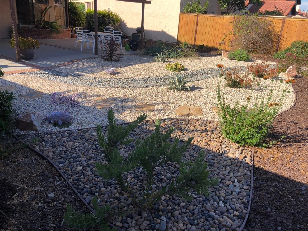 Gravel and River rock landscape by Quetzal Landscapes, Inc. - Photo 2