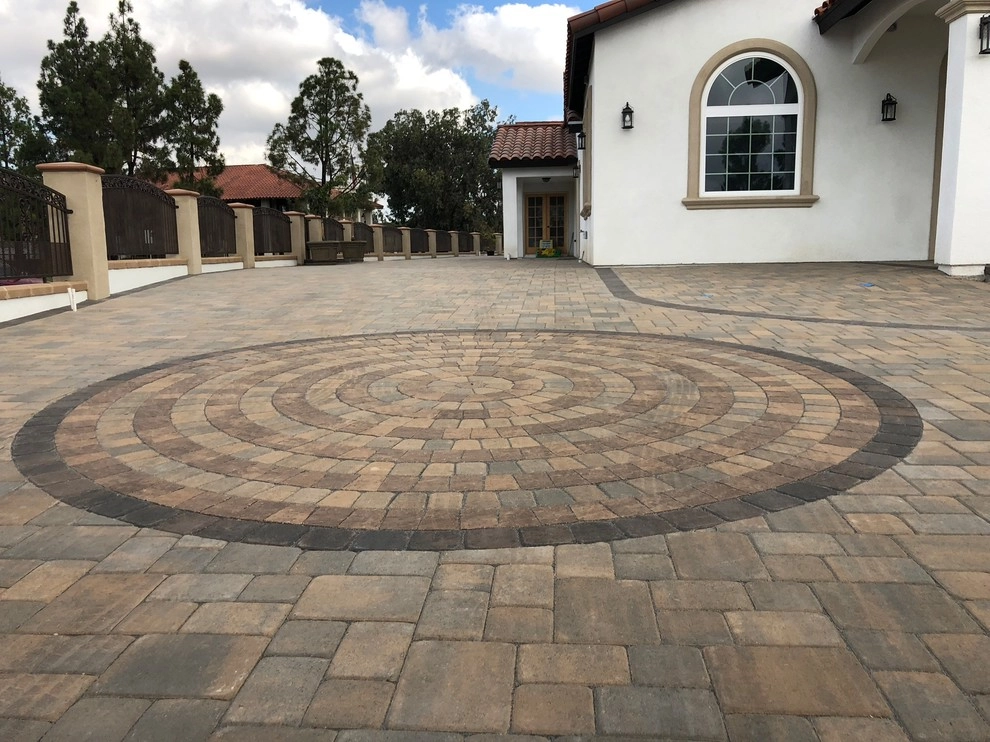 Circle pattern pavers and driveway by Quetzal Landscapes, Inc. - Photo 2
