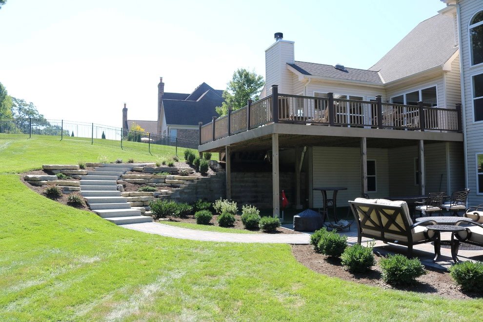 Expansive Outdoor Patio with Putting Green & Fire Pit by Quiet Village Landscaping - Photo 4
