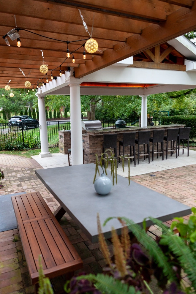 Elegant Outdoor Kitchen, Bar & Dining Space by Quiet Village Landscaping - Photo 5