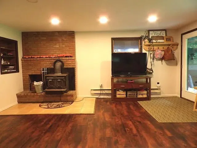 Living room renovation and structural restoration by West Bros Handyman - Photo 2