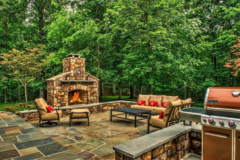 Patio with stone patio & fireplace. by Rock Water Farm - Photo 2