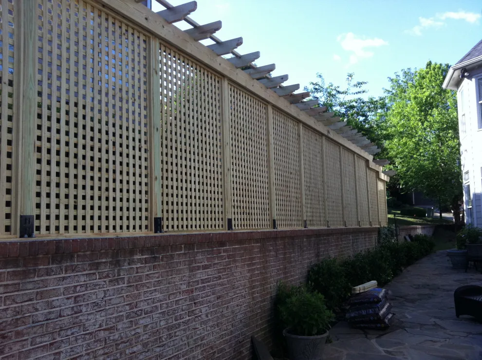 Appealing privacy barrier with a connected pergola by DeckThisOut - Photo 3