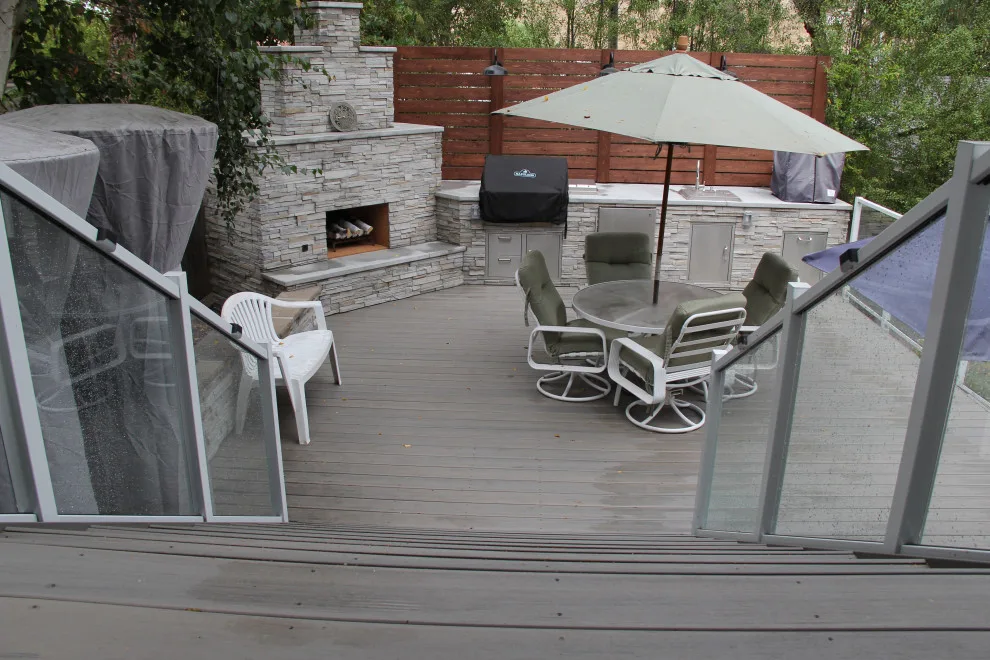 Contemporary Two-Tier Deck Featuring Custom Fireplace and Grill Area by Arroyo Grande Deck And Fence - Photo 10