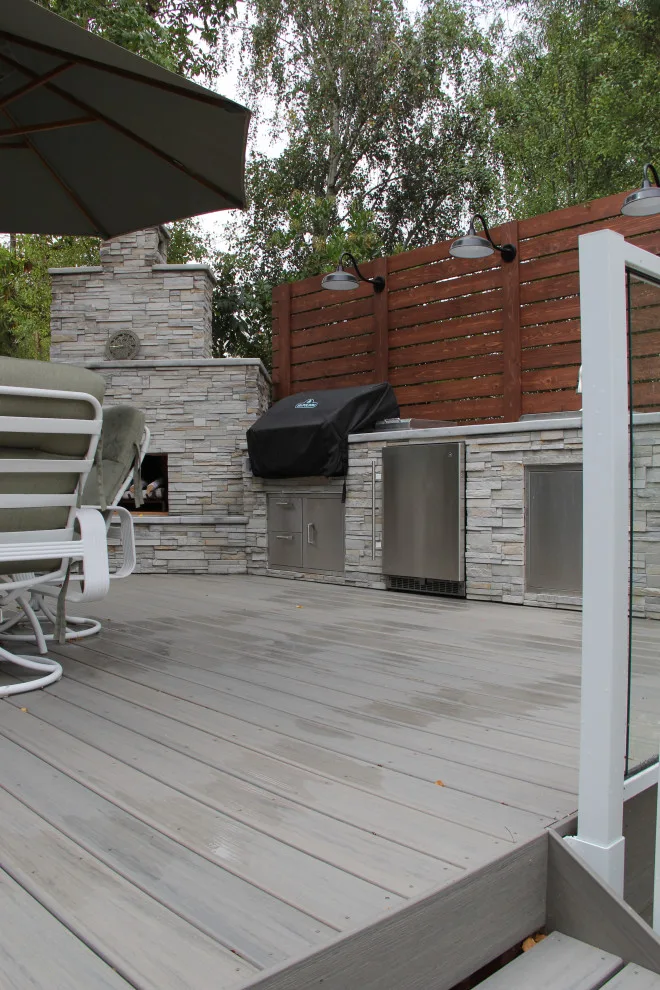 Contemporary Two-Tier Deck Featuring Custom Fireplace and Grill Area by Arroyo Grande Deck And Fence - Photo 2