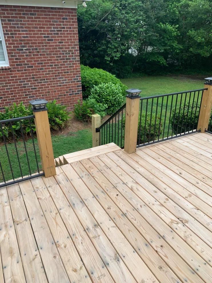 Expansive deck constructed atop an existing patio by Narron Woodworks - Photo 6