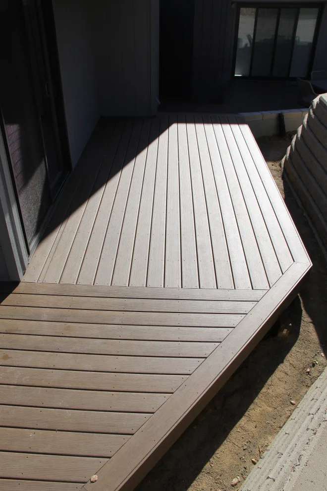 Dual-tier deck with a retaining wall by Arroyo Grande Deck And Fence - Photo 4