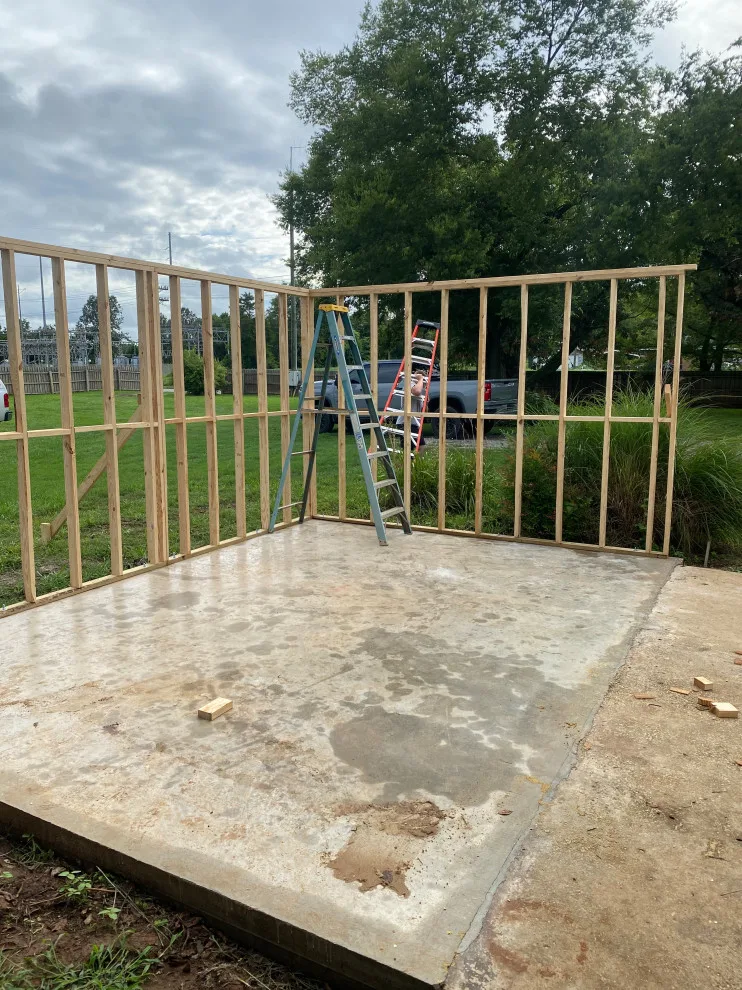 Outdoor cooking area with a lean-to structure by Sims Contracting - Photo 13