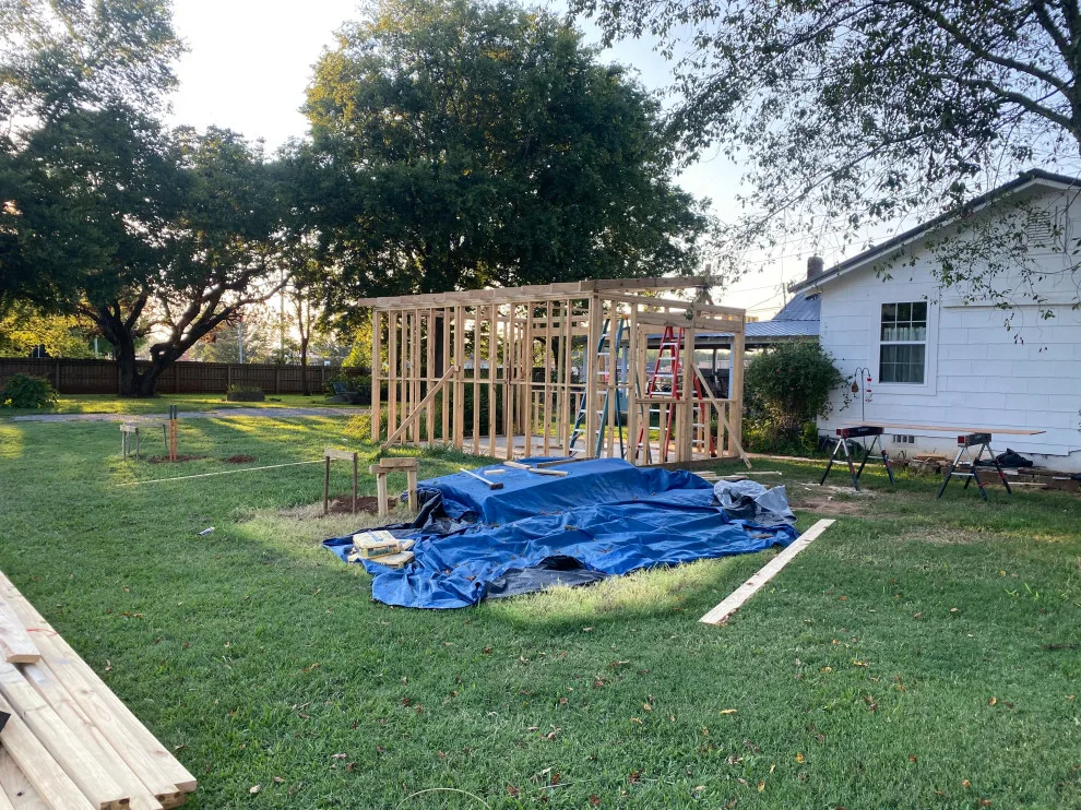 Outdoor cooking area with a lean-to structure by Sims Contracting - Photo 17
