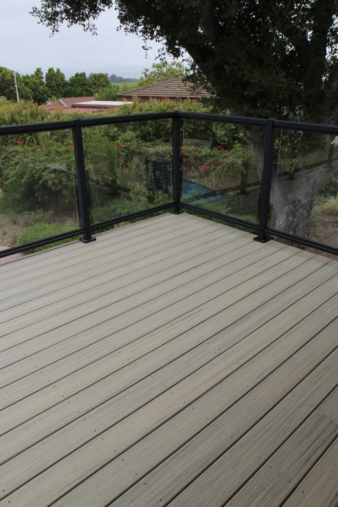 Effortless Composite Deck with Black-Framed Glass Railing by Arroyo Grande Deck And Fence - Photo 9