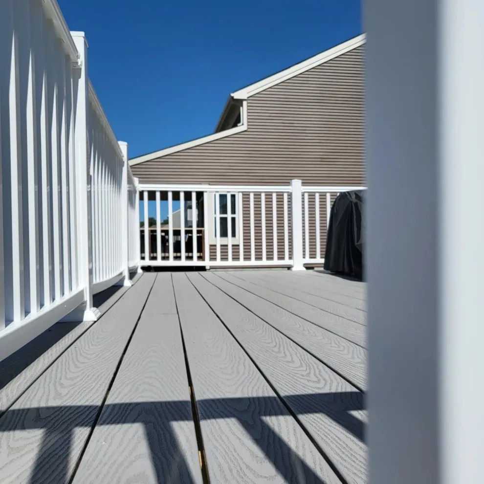 20x12 Composite Deck with Custom Two-Tier Steps and White Fascia Wrap by Jaguar Decks And Fences - Photo 5