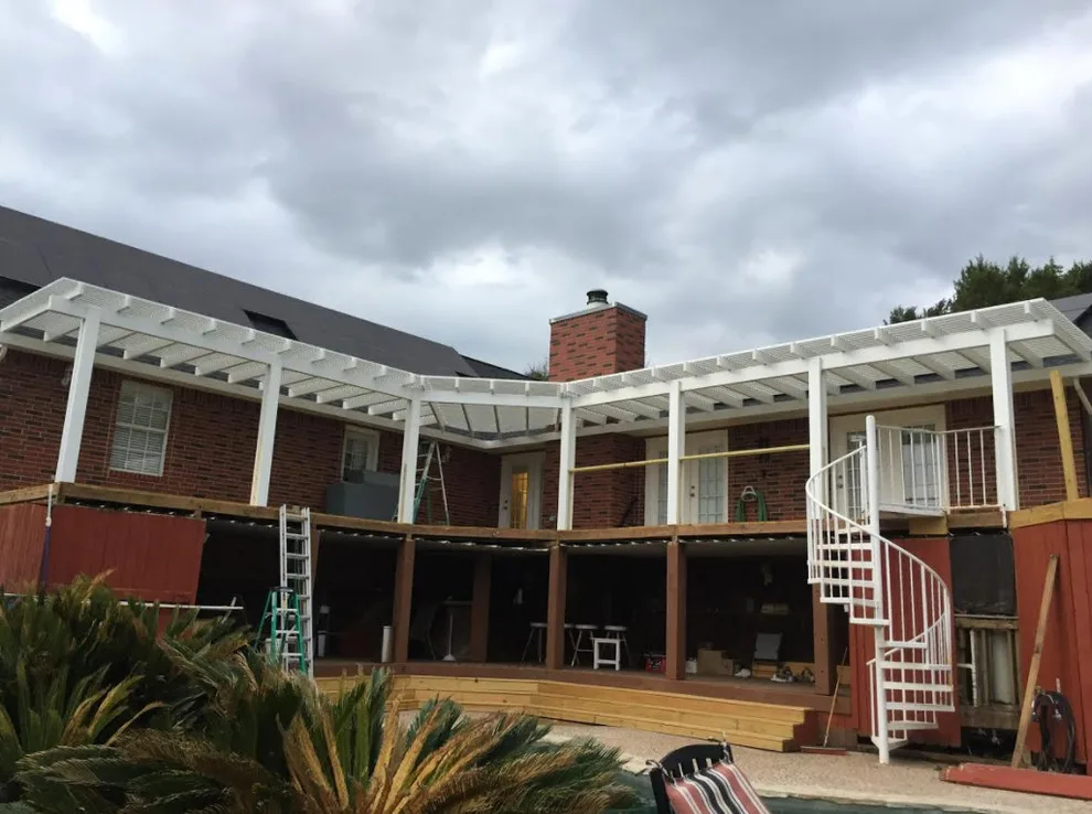 Expansive Outdoor Deck with Spiral Staircase by Moss Contracting Services - Photo 2