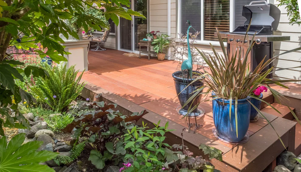 A Compact Backyard by Deck Builders Inc - Photo 14