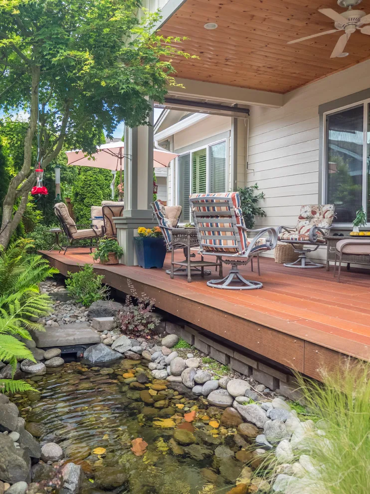 A Compact Backyard by Deck Builders Inc - Photo 11