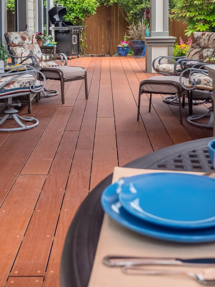 A Compact Backyard by Deck Builders Inc - Photo 6