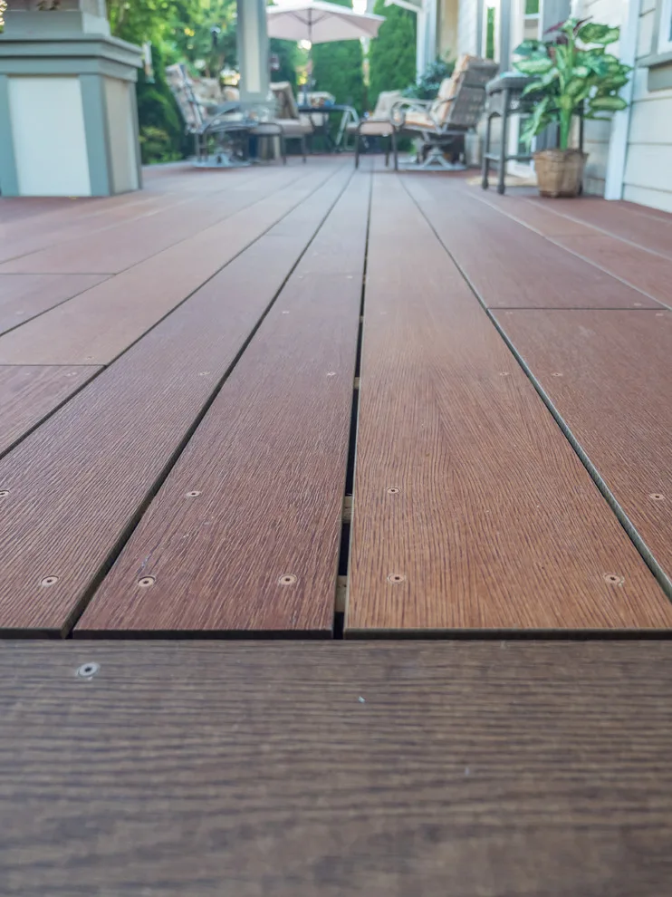 A Compact Backyard by Deck Builders Inc - Photo 7