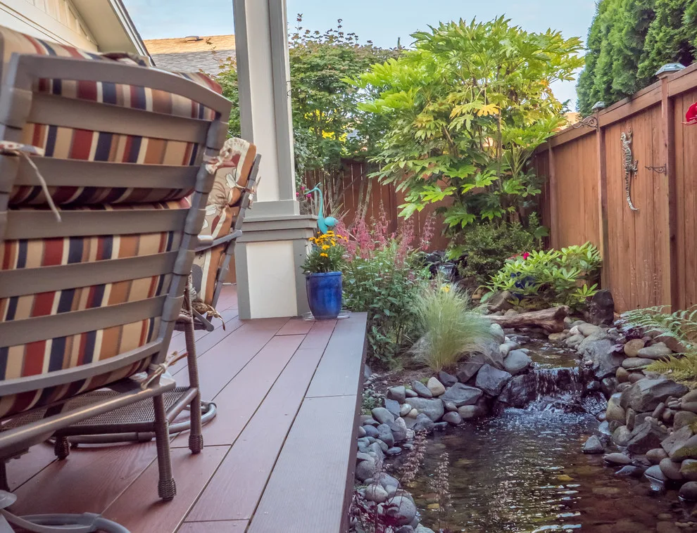 A Compact Backyard by Deck Builders Inc - Photo 13