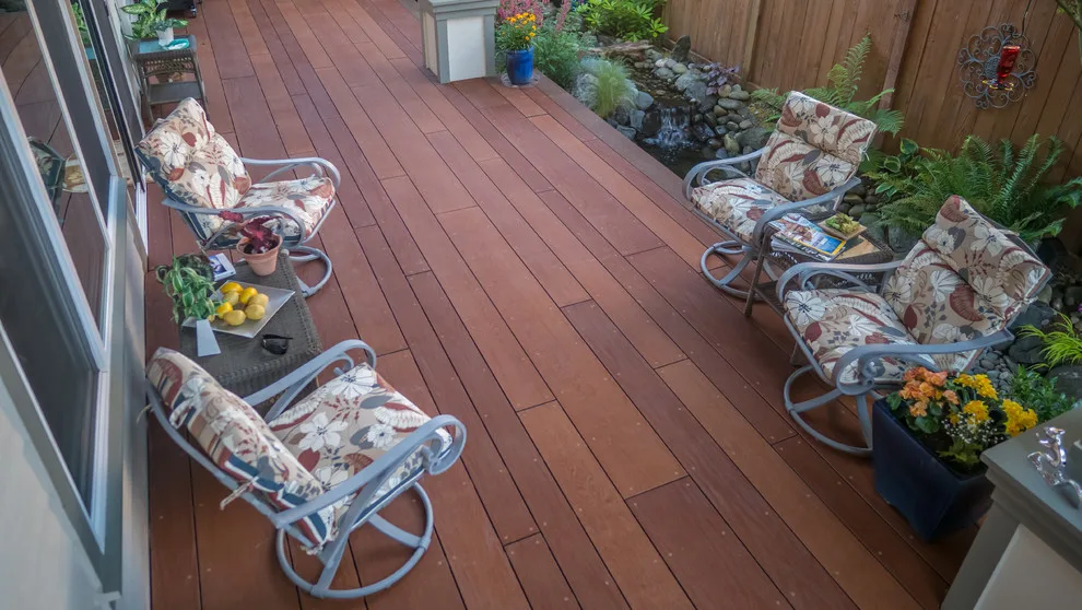 A Compact Backyard by Deck Builders Inc - Photo 9