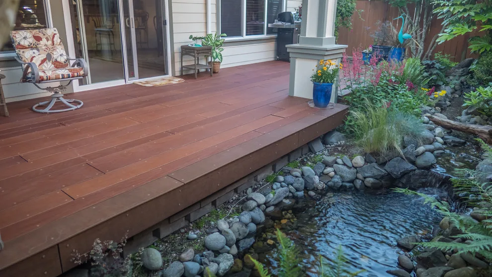 A Compact Backyard by Deck Builders Inc - Photo 10